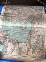 Poster laid on backdrop revealing fold lines and edge wear