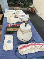 Entire lamp with harp and CFL bulb visible