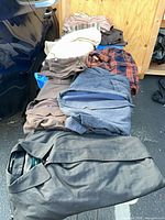 Stack of folded outerwear showing color variety