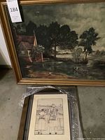 Both framed artworks in garage setting