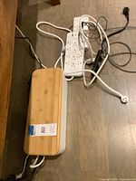 Cable box closed beside power strips