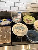 Group image of all seven ceramic items on stovetop