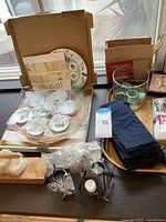Overall lot showing Passover ceramics, napkin rings, candle holders, linens