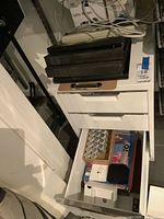 Cabinet with drawers open showing supplies