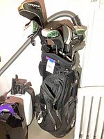 Full view of black golf bag loaded with RBZ clubs and headcovers