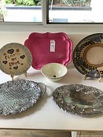 Group shot of all six serving pieces on table