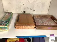 All three items on shelf: tray, jewelry box, sealed Topps card set