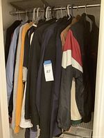Full closet view of all ten garments hung on hangers