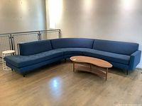 Full view of assembled curved sectional showing size, color, leg style