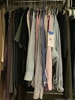 Front view of shirts on hangers showing mix of colors and patterns