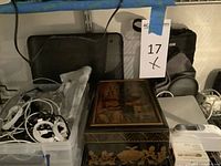 Overview of cables in bin, decorative box, document tray, camera cases