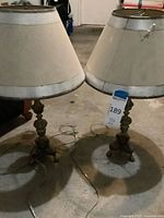 Two matching table lamps with shades on floor