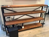 Front view of four-tier wood and metal console table showing dimensions and shelf layout