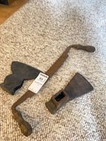 Overview of two axe heads and hand brace