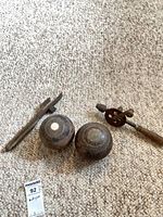 Group shot of hand drill, nail puller, two wooden bowls