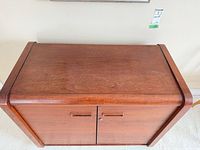 Top view of wood cabinet showing flat surface and rounded corners