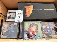 Box with Garth Brooks Limited Series, Neil Young, Ray Charles, Wendel Ferguson CDs visible
