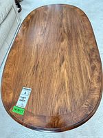 Top view of oval oak coffee table showing grain and finish