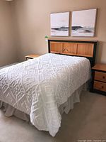 Full view of bed showing custom wood headboard