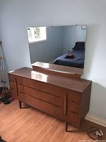 Full view of dresser and attached mirror showing overall condition and style