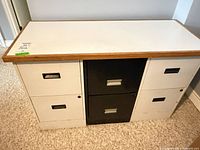 front view of 3 filing cabinets with laminate top