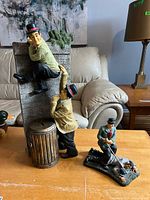 Front view of both figurines on table