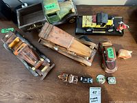 Group shot of wooden vehicles, die-cast cars and accessories