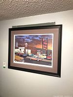 Framed print on wall showing full artwork, mat and frame