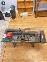 Full view of Craftsman router table on folding stand with accessories