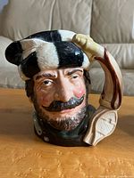 Front view of Royal Doulton The Trapper jug