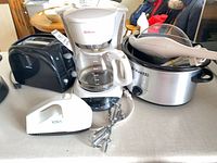 Group shot showing toaster, coffee maker, hand mixer, slow cooker