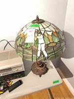 Full view of lamp with stained glass shade and base