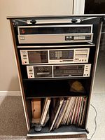 Full view of rack with three Sony components and records storage