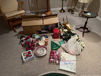 Overall view of boxed NOMA tree and assorted Christmas items on floor