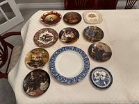 All eleven plates laid out on table