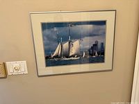 Full view of framed print on wall