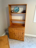 Front view showing full bookcase and cabinet doors closed