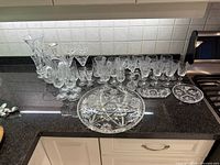 Entire assortment of crystal glasses and serving pieces on countertop