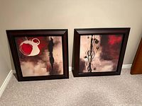 Both framed prints standing side by side showing matching size and frames