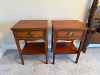 Pair of matching mahogany side tables front view