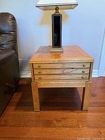 Angle view of one Lane side table next to recliner