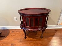 Front angled view showing overall table, glass panels, and legs