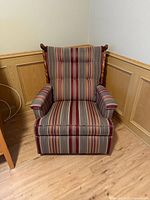 Front view of striped upholstered recliner chair