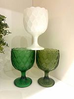Front view of three goblets showing colors and pattern