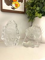 Both crystal paperweights side by side