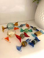 Group shot of all ten Murano glass candies on shelf