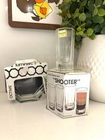 Luminarc Octime ashtray in branded sleeve beside Shooter glass box with one glass displayed