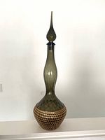 Full view of smoky green Empoli genie bottle showing height and shape