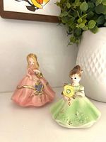 Front view of both Josef Originals figurines showing colors, poses and condition