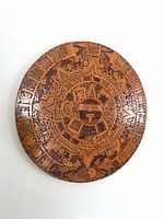 Full view of carved wooden Aztec calendar wall plaque